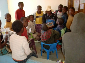 Lesotho children being read to on Christmas day 